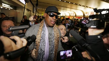 Former NBA basketball player Dennis Rodman speaks to the media after returning from his trip to North Korea at Beijing airport, December 23, 2013. REUTERS/Jason Lee (CHINA - Tags: POLITICS SPORT TPX IMAGES OF THE DAY)