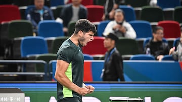 Spain's Carlos Alcaraz celebrates after winning against Britain's Daniel Evans in their men's singles match during the Shanghai Masters tennis tournament in Shanghai on October 9, 2023. (Photo by Hector RETAMAL / AFP)