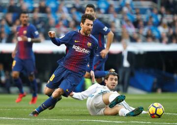 Kovacic slides in on Messi during El Clásico on Saturday.