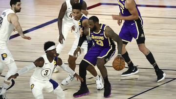 Los Angeles Lakers forward LeBron James (23) is defended by Indiana Pacers guard Malcolm Brogdon (7) during the third quarter of an NBA basketball game Saturday, Aug. 8, 2020, in Lake Buena Vista, Fla. (Kim Klement/Pool Photo via AP)