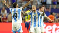 Argentina's defender #19 Nicolas Otamendi and Argentina's forward #05 Leandro Paredes celebrate their team's victory in the Conmebol 2024 Copa America tournament final football match between Argentina and Colombia at the Hard Rock Stadium, in Miami, Florida on July 14, 2024. (Photo by CHARLY TRIBALLEAU / AFP)