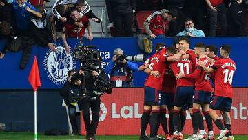 Spanish defender David Garcia is congratulated by teammates after scoring his team&#039;s first goal during the Spanish league football match between CA Osasuna and FC Barcelona at El Sadar stadium in Pamplona on December 12, 2021. (Photo by ANDER GILLENE