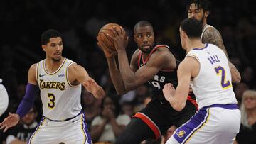 November 4, 2018; Los Angeles, CA, USA; Toronto Raptors forward Serge Ibaka (9) moves the ball against Los Angeles Lakers guard Lonzo Ball (2) and guard Josh Hart (3) during the second half at Staples Center. Mandatory Credit: Gary A. Vasquez-USA TODAY Sports