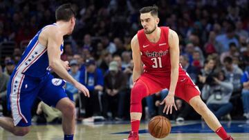 Jan 8, 2019; Philadelphia, PA, USA; Washington Wizards guard Tomas Satoransky (31) dribbles against Philadelphia 76ers guard T.J. McConnell (12) during the second quarter at Wells Fargo Center. Mandatory Credit: Bill Streicher-USA TODAY Sports