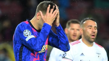 TOPSHOT - Barcelona&#039;s Spanish defender Gerard Pique reacts after missing a goal opportunity during the UEFA Champions League Group E football match between FC Barcelona and SL Benfica, at the Camp Nou stadium in Barcelona on November 23, 2021. (Photo