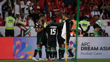 UAE&#039;s players celebrate their third goal during the 2019 AFC Asian Cup Round of 16 football match between UAE and Kyrgyzstan at the Zayed Sports City Stadium in Abu Dhabi on January 21, 2019. (Photo by Khaled DESOUKI / AFP)