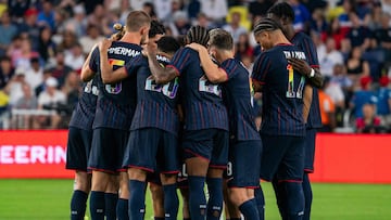 USA players huddle before the start of the second half during an international friendly football match between the USA and Switzerland at Geodis Park in Nashville, Tennessee, on June 10, 2025. (Photo by Seth Herald / AFP)