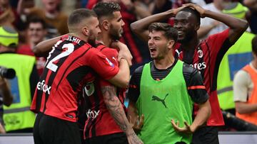 AC Milan's Croatian forward Ante Rebic (L) and AC Milan's Spanish midfielder Brahim Diaz (2nd R) celebrate their second goal by AC Milan's French defender Theo Hernandez (C) during the Italian Serie A football match between AC Milan and At