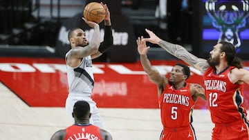 Mar 16, 2021; Portland, Oregon, USA; Portland Trail Blazers point guard Damian Lillard (L) shoots the ball over New Orleans Pelicans shooting guard Eric Bledsoe (5) and center Steven Adams (12) during the second half at Moda Center. Mandatory Credit: Soobum Im-USA TODAY Sports
