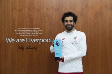 Mohamed Salah pictured with the EA SPORTS Player of the Month award for February at Melwood yesterday.