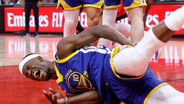 HOUSTON, TEXAS - APRIL 23: Jimmy Butler III #10 of the Golden State Warriors goes to the floor after being fouled by Amen Thompson #1 of the Houston Rockets in the first half in Game Two of the Western Conference First Round NBA Playoffs at Toyota Center on April 23, 2025 in Houston, Texas. NOTE TO USER: User expressly acknowledges and agrees that, by downloading and or using this photograph, User is consenting to the terms and conditions of the Getty Images License Agreement. Tim Warner/Getty Images/AFP (Photo by Tim Warner / GETTY IMAGES NORTH AMERICA / Getty Images via AFP)