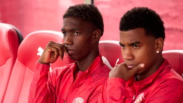 GIRONA, SPAIN - OCTOBER 25: Yaser Asprilla and Jhon Solis of Girona FC look on from the bench prior to the LaLiga EA Sports match between Girona FC and Real Oviedo at Montilivi Stadium on October 25, 2025 in Girona, Spain. (Photo by Alex Caparros/Getty Images)