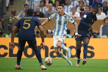 Argentina's midfielder #11 Angel Di Maria is fouled by France's forward #11 Ousmane Dembele and obtains a penalty kick during the Qatar 2022 World Cup football final match between Argentina and France at Lusail Stadium in Lusail, north of Doha on December 18, 2022. (Photo by FRANCK FIFE / AFP)