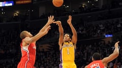 LOS ANGELES, CA - DECEMBER 19: Darius Morris #1 of the Los Angeles Lakers shoots a last second three pointer in front of Brian Cook #34 and Ryan Gomes #15 of the Los Angeles Clippers during the first quarter at Staples Center on December 19, 2011 in Los Angeles, California.   Harry How/Getty Images/AFP
== FOR NEWSPAPERS, INTERNET, TELCOS & TELEVISION USE ONLY ==
