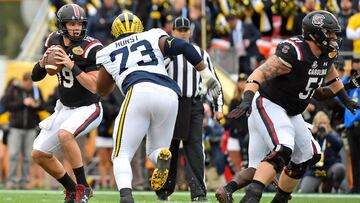 Jan 1, 2018; Tampa, FL, USA; South Carolina Gamecocks quarterback Jake Bentley (19) attempts a pass under pressure from Michigan Wolverines defensive lineman Maurice Hurst (73) during the first half in the 2018 Outback Bowl at Raymond James Stadium. Mandatory Credit: Jasen Vinlove-USA TODAY Sports