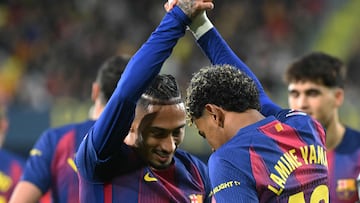 Barcelona's Spanish forward #10 Lamine Yamal celebrates with Barcelona's Brazilian forward #11 Raphinha after scoring his team's second goal during the Spanish league football match between Villarreal CF and FC Barcelona at La Ceramica Stadium in Vila-real on December 21, 2025. (Photo by JOSE JORDAN / AFP)
