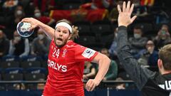 Denmark's Mikkel Hansen (L0 tries to score against Netherlands' goalkeeper Thijs Van Leeuwen during the Men's European Handball Championship match between Denmark and the Netherlands in the MVM Dome arena in Budapest, Hungary, on January 24, 2022. (Photo 