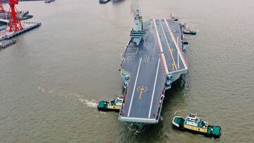 SHANGHAI, CHINA - MAY 01: The CNS Fujian, China's third aircraft carrier, begins its maiden sea trial on May 1, 2024 in Shanghai, China. The CNS Fujian, one of the most important pieces of military hardware China is working on, was officially unveiled in June 2022 in Shanghai as it was towed out of its dry dock at the China State Shipbuilding Corp's Jiangnan Shipyard. (Photo by Pu Haiyang/VCG via Getty Images)
