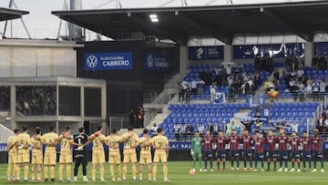 Onces del Málaga y del Huesca.
