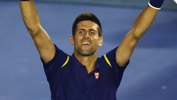 Novak Djokovic of Serbia celebrates after defeating Roger Federer of Switzerland in their semifinal match at the Australian Open tennis championships in Melbourne, Australia, Thursday, Jan. 28, 2016.(AP Photo/Rafiq Maqbool)