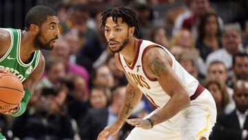 Derrick Rose defiende a Kyrie Irving.