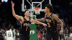 Dec 19, 2018; Boston, MA, USA; Phoenix Suns guard Devin Booker (1) celebrates with Phoenix Suns forward Kelly Oubre Jr. (3) during the second half against the Boston Celtics at TD Garden. Mandatory Credit: Winslow Townson-USA TODAY Sports