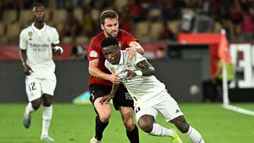 Real Madrid's Brazilian forward Vinicius Junior vies with Osasuna's Spanish midfielder Jon Moncayola (back) during the Spanish Copa del Rey (King's Cup) final football match between Real Madrid CF and CA Osasuna at La Cartuja stadium in Seville on May 6, 2023. (Photo by JAVIER SORIANO / AFP)