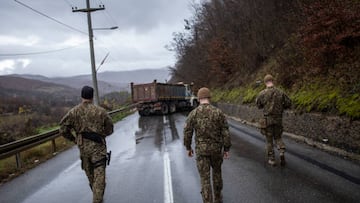 ZUBIN POTOK, KOSOVO - DECEMBER 11: NATO led Lithuanian solders head to inspect trucks at a roadblock on one of the main roads to the border crossing point with Serbia on December 11, 2022 near Zubin Potok, Kosovo. (Photo by Ferdi Limani/Getty Images)