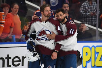 Darren Helm #43 and Andrew Cogliano #11 of the Colorado Avalanche react 