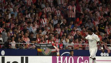 (FILES) In this file photo taken on September 18, 2022 Real Madrid's Brazilian forward Vinicius Junior gestures toward the public during the Spanish League football match between Club Atletico de Madrid and Real Madrid CF at the Wanda Metropolitano stadium in Madrid. - Spanish justice announced on September 23, 2022 to have launched an investigation against Atletico de Madrid fans, accused of singing racist songs against Real Madrid's Brazilian forward, Vinicius Junior, during a derby between the two clubs held on September 18. (Photo by OSCAR DEL POZO / AFP)