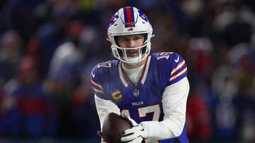 ORCHARD PARK, NEW YORK - JANUARY 19: Josh Allen #17 of the Buffalo Bills receives the ball against the Baltimore Ravens in the third quarter during the AFC Divisional Playoff at Highmark Stadium on January 19, 2025 in Orchard Park, New York. Al Bello/Getty Images/AFP (Photo by AL BELLO / GETTY IMAGES NORTH AMERICA / Getty Images via AFP)