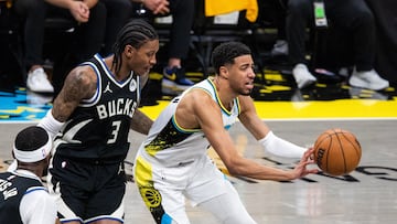 Apr 29, 2025; Indianapolis, Indiana, USA; Indiana Pacers guard Tyrese Haliburton (0) passes the ball while Milwaukee Bucks guard Kevin Porter Jr. (3) defends during game five of the first round for the 2024 NBA Playoffs at Gainbridge Fieldhouse. Mandatory Credit: Trevor Ruszkowski-Imagn Images