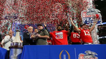 Dec 31, 2022; Atlanta, Georgia, USA; Georgia Bulldogs head coach Kirby Smart and defensive back Christopher Smith (29) and offensive lineman Sedrick Van Pran (63) and quarterback Stetson Bennett (13) celebrate in the confetti after a victory against the Ohio State Buckeyes in the 2022 Peach Bowl at Mercedes-Benz Stadium. Mandatory Credit: Brett Davis-USA TODAY Sports