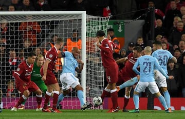 Manchester City's Argentinian defender Nicolas Otamendi (R) takes a shot during the UEFA Champions League first leg quarter-final football match between Liverpool and Manchester City, at Anfield stadium in Liverpool, north west England