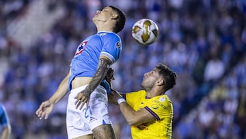 Gabriel Fernandez (L) of Cruz Azul jumps for the ball with Sebastian Caceres (R) of America during the Semifinal second leg match between Cruz Azul and America as part of the Liga BBVA MX, Torneo Apertura 2024 at Ciudad de los Deportes Stadium on December 08, 2024 in Mexico City, Mexico.