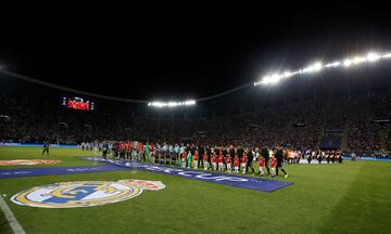 Real Madrid and Manchester United perform the pre-match handshakes.