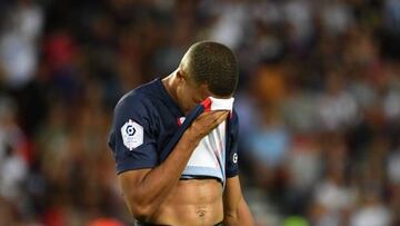 Paris Saint-Germain's French forward Kylian Mbappe reacts after missing to score on a penalty kick during the French L1 football match between Paris-Saint Germain (PSG) and Montpellier Herault SC at The Parc des Princes Stadium in Paris on August 13, 2022. (Photo by EMMANUEL DUNAND / AFP) (Photo by EMMANUEL DUNAND/AFP via Getty Images)