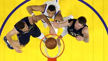 SAN FRANCISCO, CALIFORNIA - MAY 20: Otto Porter Jr. #32 of the Golden State Warriors shoots the ball against Maxi Kleber #42 and Luka Doncic #77 of the Dallas Mavericks