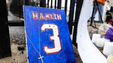 Items are placed by football fans during a vigil outside University of Cincinnati Medical Center where Buffalo Bills safety Damar Hamlin lies in critical condition, after suffering a cardiac arrest during the January 2 National Football League (NFL) game against the Cincinnati Bengals, in Cincinnati, Ohio, U.S., January 3, 2023.  REUTERS/Megan Jelinger