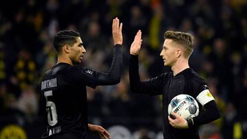 Dortmund&#039;s German midfielder Marco Reus is congratulated by teammate Dortmund&#039;s Moroccan defender Achraf Hakimi (L) after scoring during the German first division Bundesliga football match Borussia Dortmund v Fortuna Dusseldorf in Dortmund on De