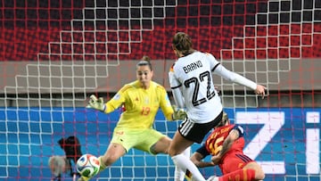 Germany's midfielder Jule Brand makes an attempt on goal but fails to score past Spain's goalkeeper #13 Cata Coll (L) during UEFA Women's Nations League first leg final football match between Germany and Spain in Kaiserslautern, western Germany on November 28, 2025. (Photo by THOMAS KIENZLE / AFP)