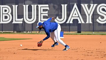 Feb 19, 2025; Dunedin, FL, USA; Toronto Blue Jays infielder Vladimir Guerrero Jr. (27) fields a ground ball during spring training at Cecil B. Englebert Complex. Mandatory Credit: Jonathan Dyer-Imagn Images