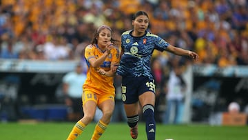 Tigres midfielder #08 Alexia Delgado and America's midfielder #18 Nancy Antonio fight for the ball during the Liga MX Femenil Apertura final second leg football match between Tigres and America at the Universitario Stadium in Monterrey, Nuevo Leon state, Mexico on November 23, 2025. (Photo by Julio Cesar AGUILAR / AFP)