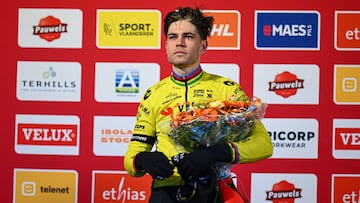 Second placed Belgian Wout van Aert celebrates on the podium after the men's elite race during the UCI World Cup cyclocross competition, in Maasmechelen on January 25, 2025. (Photo by LUC CLAESSEN / Belga / AFP) / Belgium OUT
