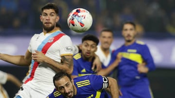 Boca Juniors' defender Carlos Izquierdoz (bottom-C) heads the ball before Arsenal's defender Gonzalo Goni (L) during their Argentine Professional Football League Tournament 2022 match at La Bombonera stadium in Buenos Aires, on June 5, 2022. (Photo by ALEJANDRO PAGNI / AFP) (Photo by ALEJANDRO PAGNI/AFP via Getty Images)