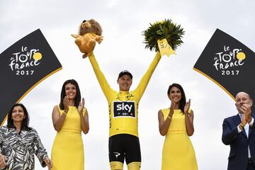 Tour de France 2017's winner Great Britain's Christopher Froome celebrates his overall leader yellow jersey on the podium at the end of the 103 km twenty-first and last stage of the 104th edition of the Tour de France cycling race on July 23, 2017 between