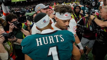 Philadelphia Eagles' quarterback #01 Jalen Hurts and Kansas City Chiefs' quarterback #15 Patrick Mahomes greet each other at the end of Super Bowl LIX, after the Philadelphia Eagles defeated the Kansas City Chiefs 40-22 at Caesars Superdome in New Orleans, Louisiana, February 9, 2025. (Photo by TIMOTHY A. CLARY / AFP)