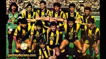 Peñarol tiene en sus vitrinas cinco Copas Libertadores (1960, 1961, 1966, 1982 y 1987). Esta imagen corresponde al equipo aurinegro que se consagró en 1987, cuando superó en la Final al América de Cali. En la edición actual, el conjunto uruguayo forma parte del grupo 4 junto con Atlético Nacional de Medellín, Sporting Cristal y el vencedor de la serie entre Huracán y Caracas.