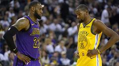 Los Angeles Lakers forward LeBron James (23) talks to Golden State Warriors forward Kevin Durant during the second half of an NBA basketball game Tuesday, Dec. 25, 2018, in Oakland, Calif. The Lakers won 127-101. (AP Photo/Tony Avelar)