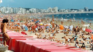 Gran Canaria, full beach during summer day with the sea and hotels in sight.Scan from photo - 1981